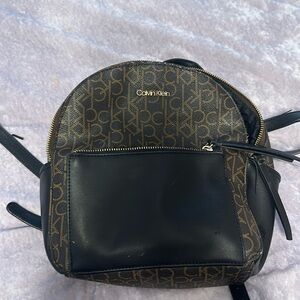 Brown Calvin Klein leather backpack with broken strap